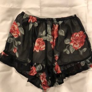 Sheer rose and ruffled shorts